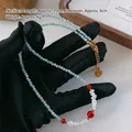 Beaded necklace with light blue stones, white pearls, and red agate with golden clasp - Amazonite Agate Necklace XL0705