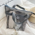Portable gray mesh travel organizer bag with handle for cosmetics and toiletries - Handbag Style / Light Gray