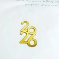 Close-up of golden acrylic 2026 number cake topper with a shiny mirror finish effect - 2026 Gold Style 4 / 1.3mm / Gold
