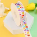 White polyester ribbon with colorful Children's Day print on a spool for gift wrapping - Colorful Bold