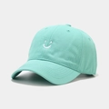 Minimalist mint green cotton baseball cap featuring a white embroidered smiley face design - Smile Embroidery Style / Teal