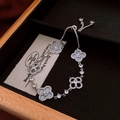 Silver four-leaf clover zircon bracelet with mother of pearl and adjustable drawstring - White