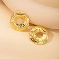 Detailed macro view of gold-plated stainless steel earrings with brushed and hammered texture - Irregular Round Cookie Stud Earrings