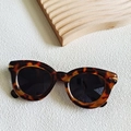 Retro tortoiseshell cat-eye sunglasses with dark lenses and gold metal trim accents - Tortoise with Gray Lens