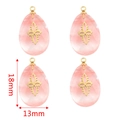 Set of four pink crystal water drop pendants with golden filigree patterns and loops - Teardrop Rose Quartz - Cross