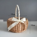 Detail view of a 19cm handwoven wicker flower basket with white ribbon bow and satin handle - Large (19cm Diameter) / White Ribbon