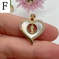 Macro view of gold heart pendant with white mother of pearl and Guadalupe saint detail - Style F-Pave Zirconia Religious Icon
