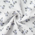 Detail of soft white cotton crepe fabric with delicate purple floral print patterns - Mixed Stock