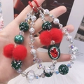Christmas style phone strap with red and green beads, pompom and a red gemstone - Christmas Red & Green