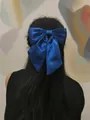 Deep blue oversized satin bow hair clip accessory worn on back of hair by model - Spring Clips / Blue