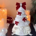 Macro shot of white tiered fabric Christmas tree with pearls and red velvet bows decoration - Rhinestone Bow Christmas Tree Decoration-with Light-Red & White Bow