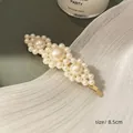 Elegant 8.5cm gold-finish hair clip featuring a shuttle-shaped cream pearl arrangement - Three Flowers Combo Clip
