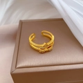 Elegant gold bow open ring with cubic zirconia on premium jewelry display box - Adjustable Open / Gold