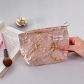 Elegant dusty pink floral jacquard makeup bag with gold embroidery and UMIT BENAN tag - Flowing Pink Small