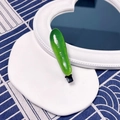 Realistic green vegetable hair clip with glossy finish and secure black metal duckbill clip - Cucumber