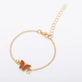 Close-up of adjustable gold chain bracelet with a brown enamel butterfly charm - Brown