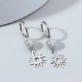 Detail of silver titanium steel earrings with white pearl bead and sun flower pendant - Sun & Pearl Style