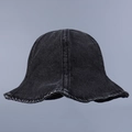 Detailed close-up of distressed washed black denim fabric texture on a bucket hat - M (56-58cm) / Black