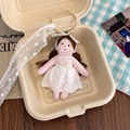 Detail of floral doll pendant featuring intricate lace dress and polka dot ribbon strap - Pearl Necklace White Lace Dress