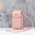 Pink multi-functional crossbody phone wallet with adjustable strap on marble surface - Pink