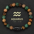 Aquarius zodiac bracelet with tiger eye and agate beads on black sand background - Aquarius