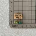 Miniature resin Happy Farm road sign accessory in brown, yellow and green colors - Signpost