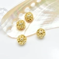 Set di quattro perline distanziatrici dorate traforate con zirconi su conchiglia - Oro|8 Mm
