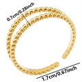 Macro shot of gold double layer beaded ring with 0.7cm width dimensions - Adjustable Open / Gold