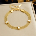 Detail of gold mesh chain bracelet with three rectangular clear faceted stones and lobster clasp - Clear White (B1963)