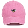 Close-up of pink washed cotton baseball cap featuring detailed bee embroidery on the front - Pink