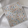 Macro detail of 5D jelly nail stickers with colorful rhinestones and gold foil accents - Colorful Irregular Rhinestone Style (CO-403)