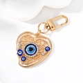 Goldener Herz-Schlüsselanhänger mit blauem Auge-Motiv und funkelnden Strasssteinen - Gold Herz