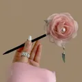 Detail of pink silk flower hair pin with white pearl accent and elegant tassel - Pink Flower Hair Stick