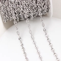 Macro shot of silver coffee bean link chain rolls for DIY jewelry making and accessories - 5.4*7.2mm / White Gold