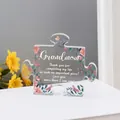 Puzzle-shaped clear acrylic plaque for grandma with pink floral motifs and warm lighting - Grandma Tulip Book Style (Q54)