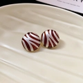 Macro view of round red zebra pattern stud earrings with enamel silver striped finish - 17# Silver Round Pattern Enamel Stud Earrings
