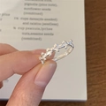 Detail of 925 sterling silver ring featuring a continuous ribbon bow knot design - Silver Bowknot (JZ0620)