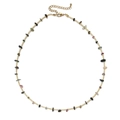 Bohemian style necklace with multi-color crushed stones and gold-tone beads on white surface - Multi-color