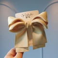 Champagne gold satin bow hair clip for girls with elegant layered ribbon design - Yellow