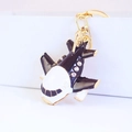 Black and white enamel cartoon plane keychain with gold finish and sparkling rhinestones - Black A380 Aircraft