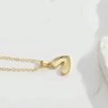 Minimalist gold heart pendant necklace with textured honeycomb surface and delicate chain - Letter V