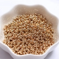 Polished 14k gold-filled solid round spacer beads in a star-shaped ceramic bowl - 14K Gold