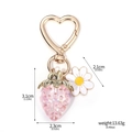 Pink strawberry charm and white daisy keychain with heart-shaped golden clasp - K00869-05 Pink Rhinestone Inlaid Strawberry with Daisy