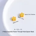 Detailed macro view of 6mm gold flower-shaped spacer bead with matte finish and 1.2mm hole - Plum Flower 6mm Through Hole (1pc)