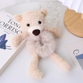 Detail view of the beige teddy bear plush hair tie with soft faux fur and sherpa texture - Off-white