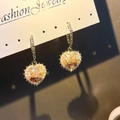 Golden heart drop earrings with amber crystal inlay and pearl border on white jewelry card - Gold Heart Pearl Wrap Studs (E2849-2)