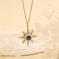 Detail of sunburst Evil Eye pendant with zircons on 18K gold plated chain necklace - Light Blue Star-B5