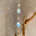 Golden geometric suncatcher with crystal balls and stars creating rainbow light reflections - B22 Style