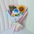 Detail of handcrafted crochet bouquet featuring sunflowers, roses and stylish gift wrap - Handmade Crochet Bouquet / Blue