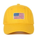 Detailed close-up of high-quality embroidery on a yellow American flag baseball cap - Yellow